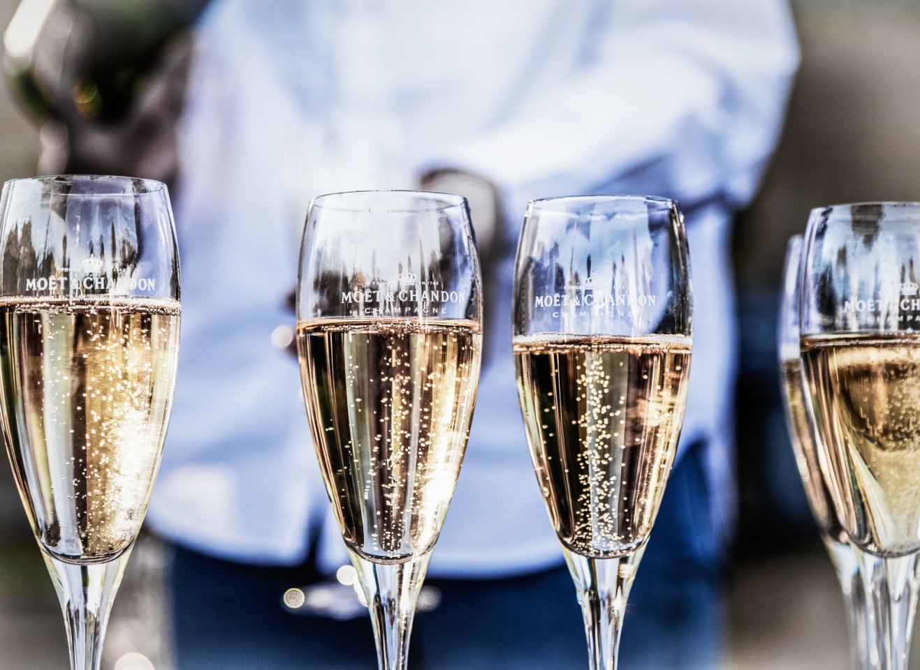 Champagne flutes filled with bubbly liquid. Main Image